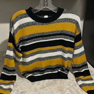 Divided knit sweater, black yellow grey and white horizontal stripes